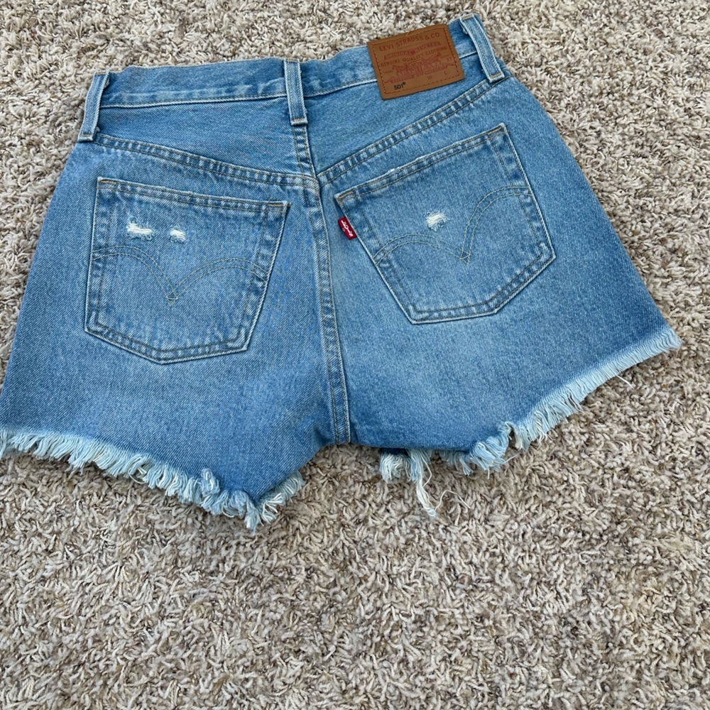 Levi’s shorts. Light/medium wash. Never worn. Size 23 waist.